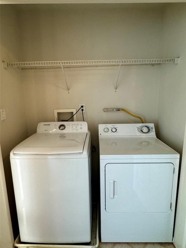 clothes washing area with laundry area and separate washer and dryer