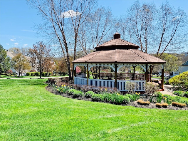 view of home's community with a gazebo and a lawn