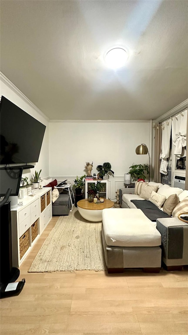 interior space featuring light wood-type flooring and crown molding