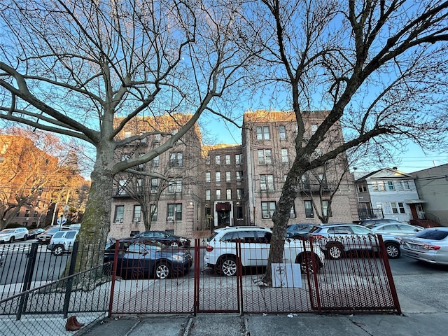 view of building exterior featuring fence