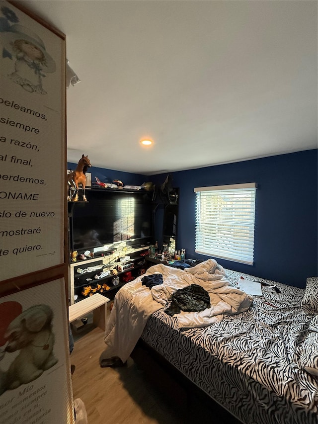 bedroom featuring wood finished floors