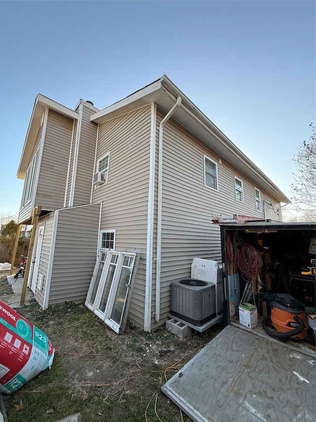 view of property exterior with central AC