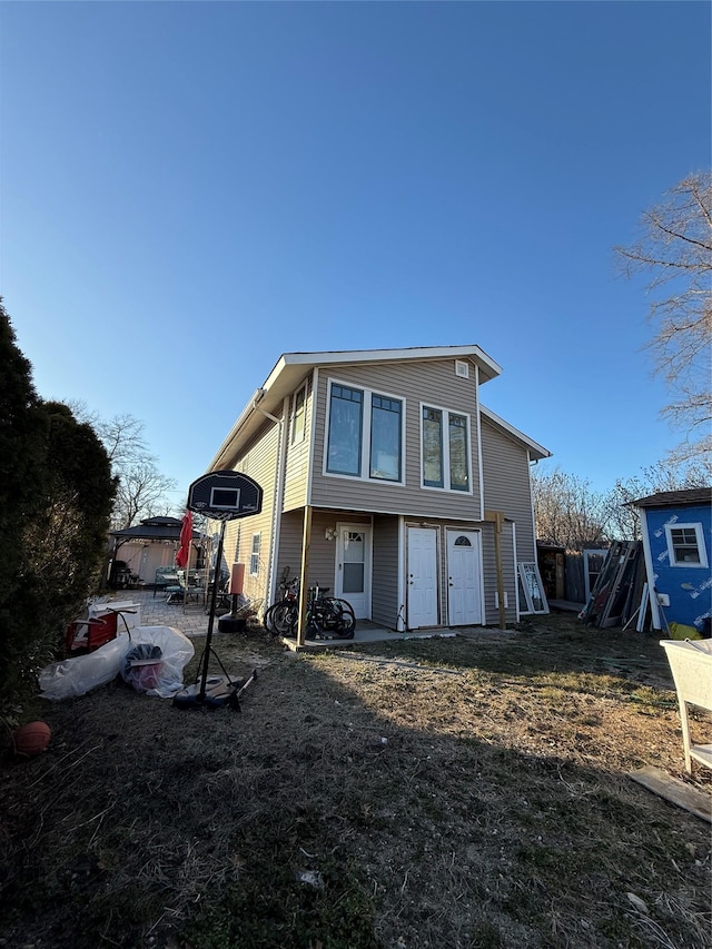 back of house with a patio area