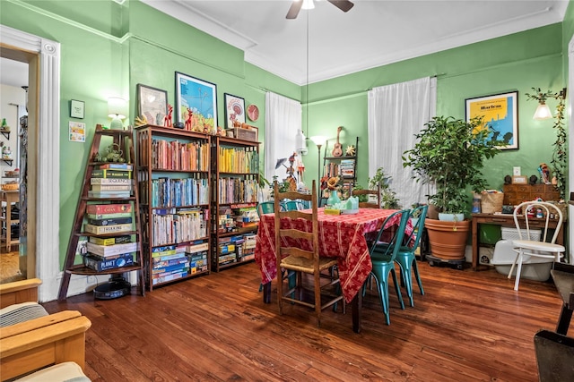 dining room featuring crown molding, ceiling fan, and wood finished floors