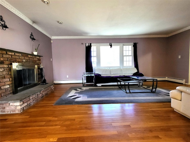 living area featuring a baseboard heating unit, a fireplace, wood finished floors, baseboards, and ornamental molding