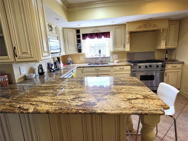 kitchen featuring crown molding, stainless steel stove, cream cabinets, light tile patterned flooring, and a sink