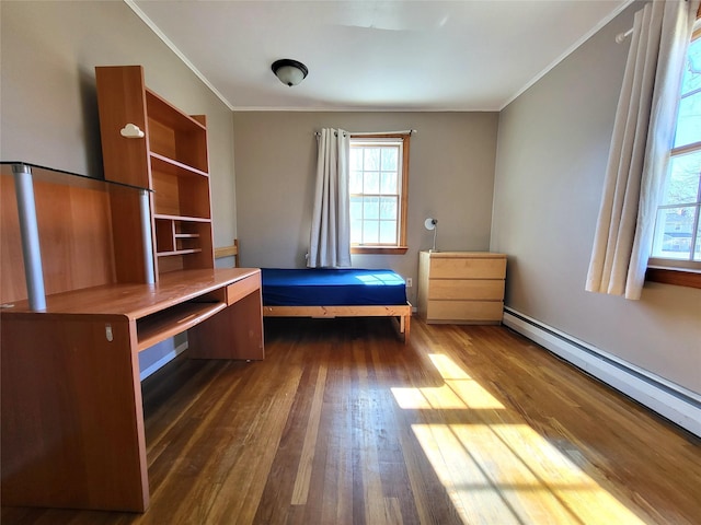 unfurnished bedroom with a baseboard radiator, dark wood-style flooring, and crown molding