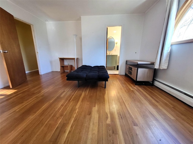 bedroom featuring ornamental molding and hardwood / wood-style flooring