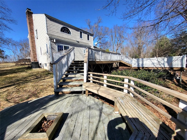 wooden terrace featuring stairs and cooling unit