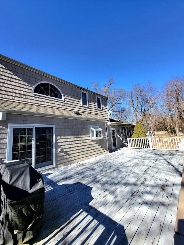 wooden terrace with area for grilling