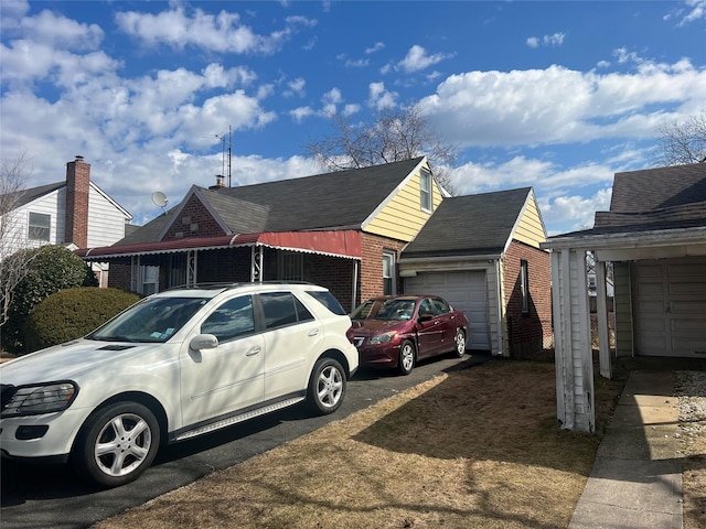 view of home's exterior featuring a garage and brick siding