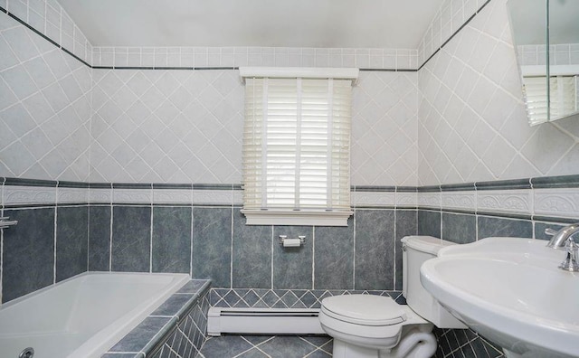 full bath featuring tile walls, tiled bath, a baseboard radiator, a sink, and tile patterned flooring