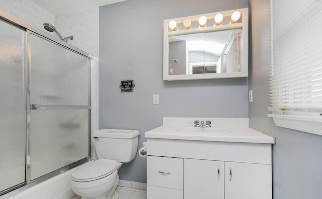 bathroom with baseboards, bath / shower combo with glass door, toilet, marble finish floor, and vanity