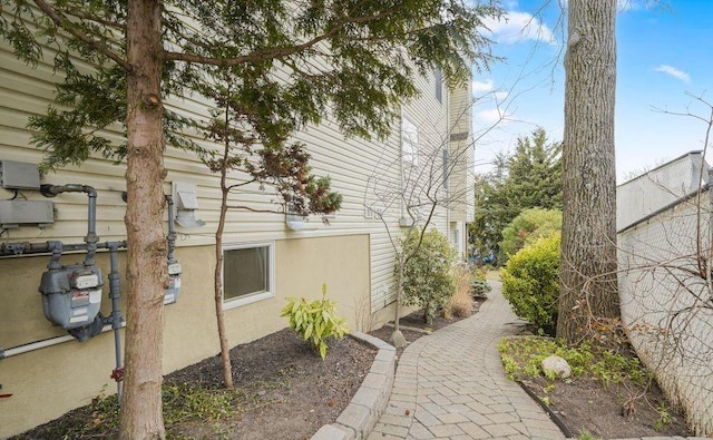 view of side of property with stucco siding