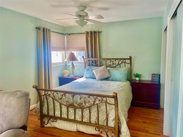 bedroom featuring a closet, ceiling fan, and wood finished floors