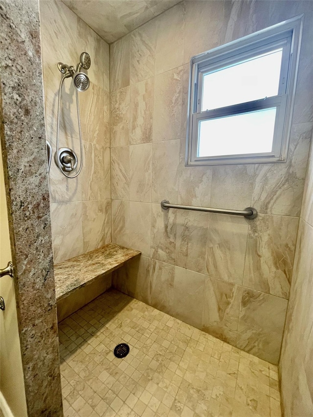 bathroom featuring a tile shower