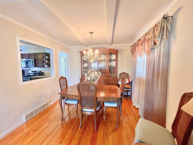 dining room featuring light wood finished floors, baseboards, visible vents, beamed ceiling, and an inviting chandelier