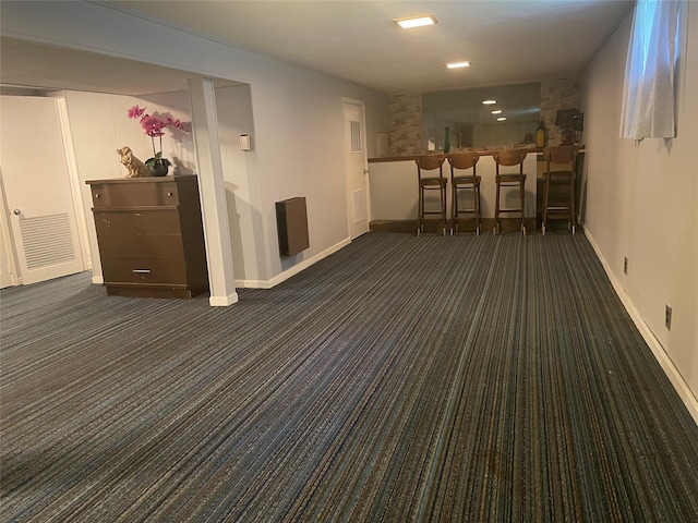 interior space with carpet flooring and baseboards