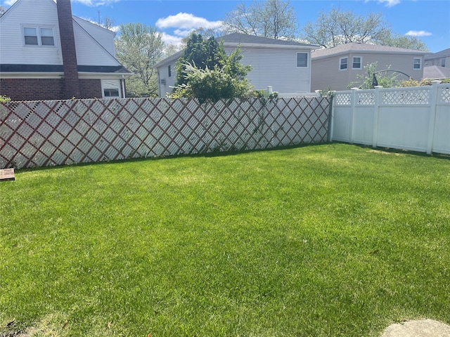 view of yard with fence