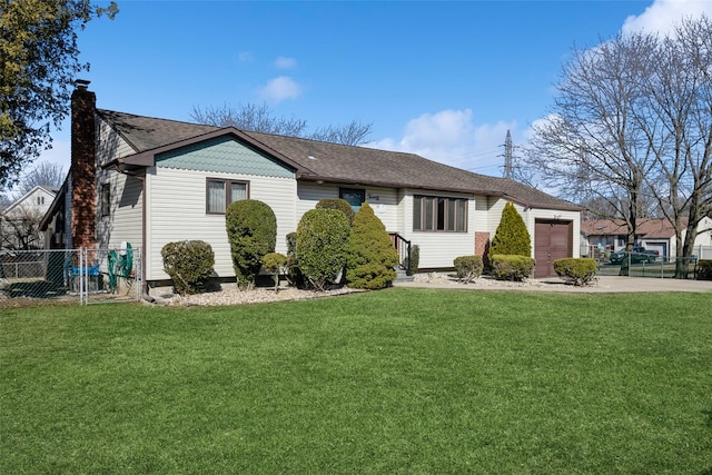 ranch-style house featuring a garage, a front yard, and fence