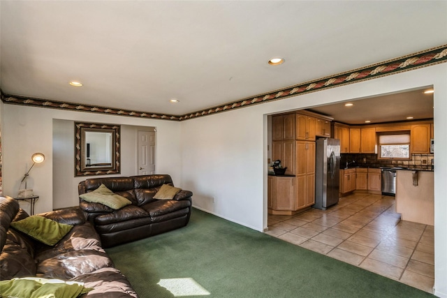 living area with light carpet, light tile patterned floors, and recessed lighting