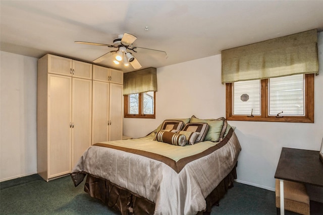 bedroom featuring a closet, a ceiling fan, baseboards, and dark colored carpet