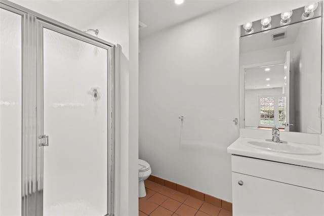 bathroom with tile patterned floors, visible vents, a stall shower, and vanity