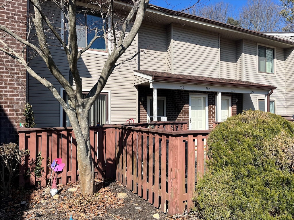 view of property featuring brick siding