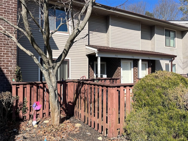 view of property featuring brick siding