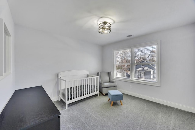 bedroom with baseboards, visible vents, and carpet floors