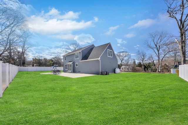 exterior space featuring a patio, a yard, and a fenced backyard