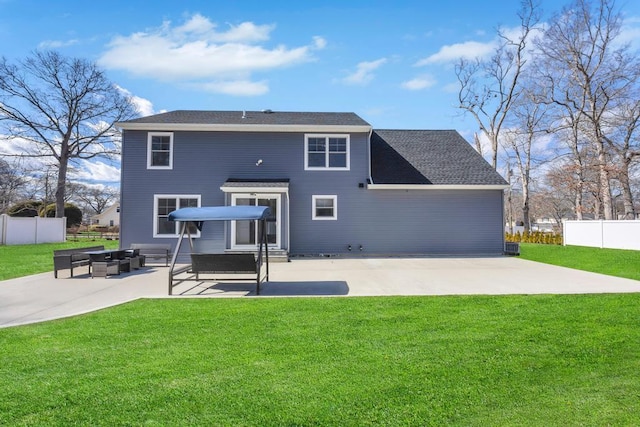 back of house with a patio, a yard, and fence