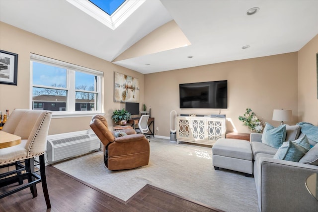 living area with baseboards, lofted ceiling with skylight, recessed lighting, wood finished floors, and a wall mounted AC