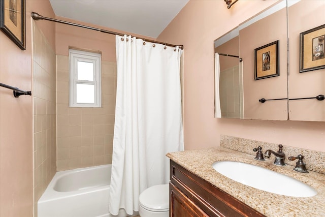 bathroom featuring vanity, toilet, and shower / bath combo with shower curtain