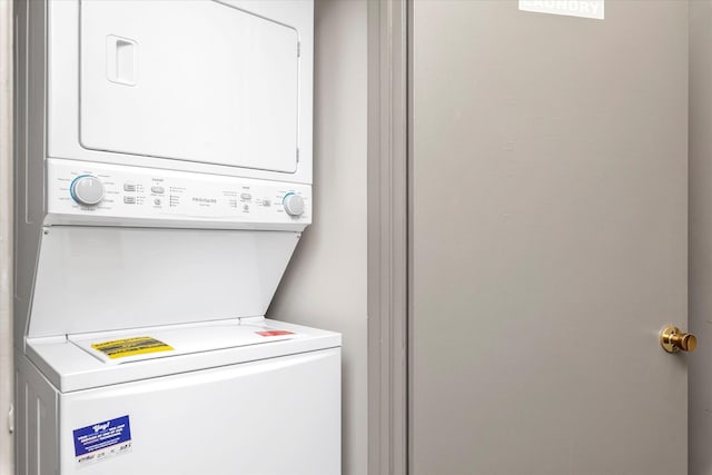 washroom featuring laundry area and stacked washing maching and dryer