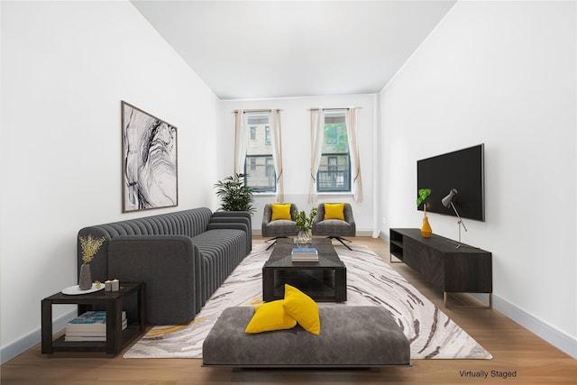 living room featuring baseboards and wood finished floors