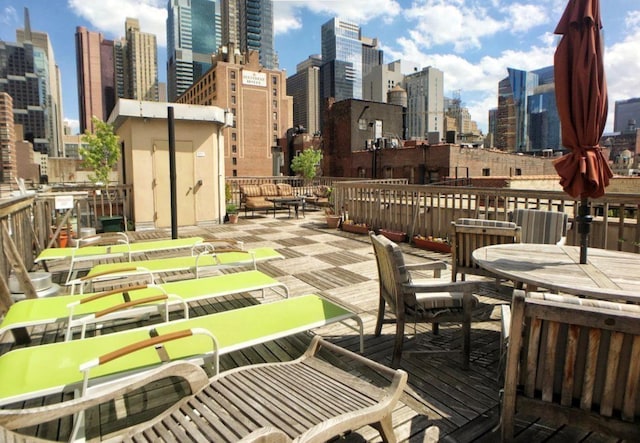 wooden deck featuring a city view