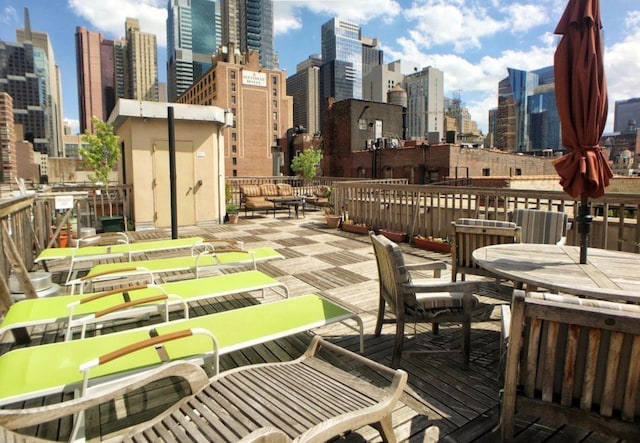 wooden deck with a city view