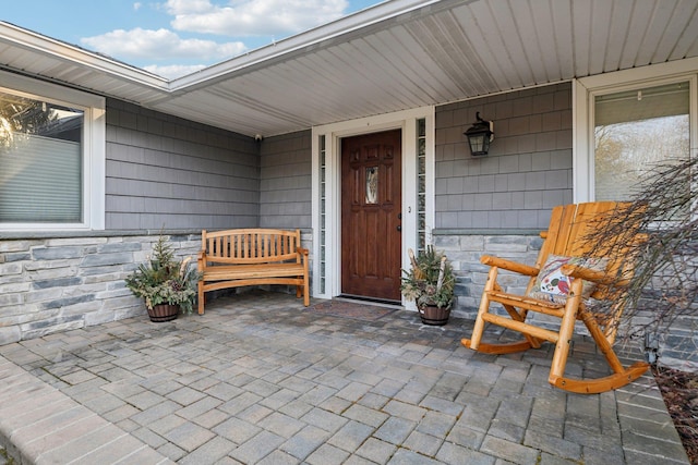 entrance to property with stone siding