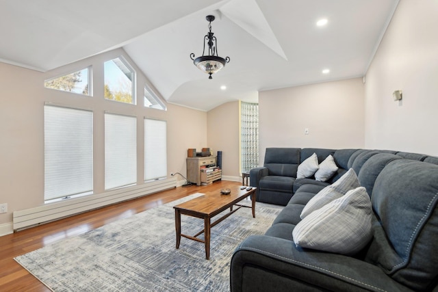 living room with wood finished floors, baseboards, recessed lighting, vaulted ceiling, and baseboard heating