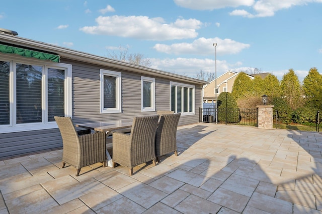 view of patio / terrace featuring outdoor dining space and fence