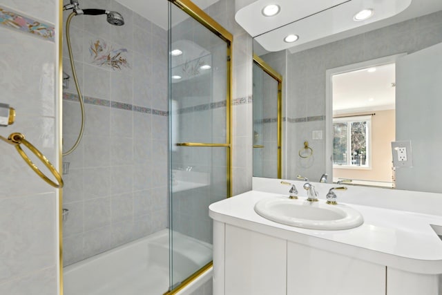 full bath featuring vanity, recessed lighting, and tiled shower / bath combo