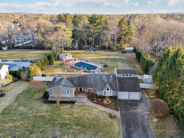 drone / aerial view featuring a forest view