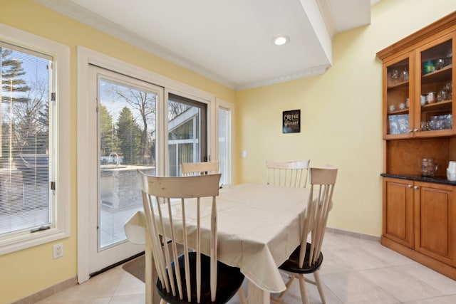 dining area with light tile patterned floors, recessed lighting, baseboards, and ornamental molding