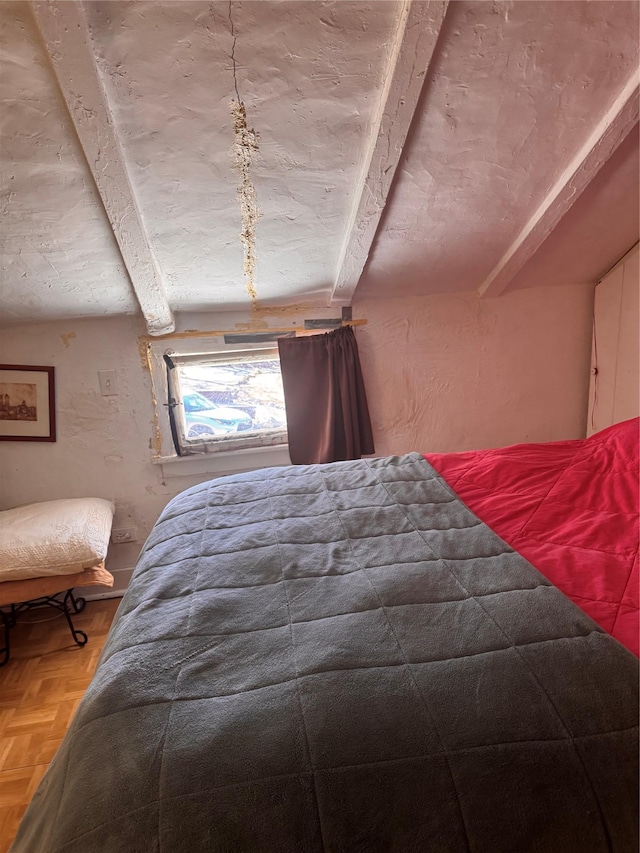 unfurnished bedroom with beamed ceiling