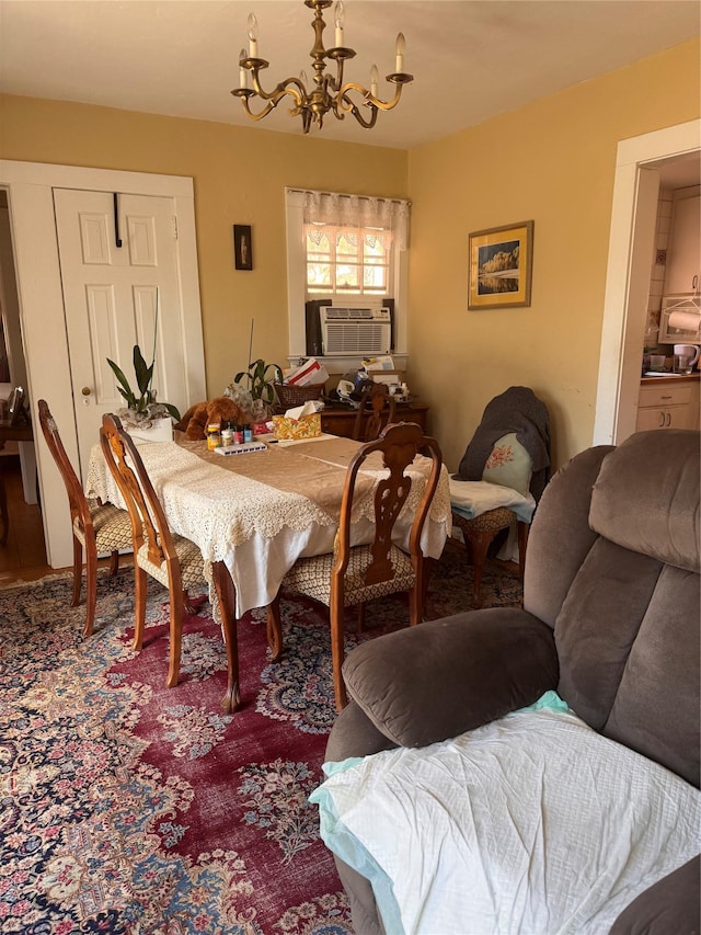 dining room with a notable chandelier and cooling unit