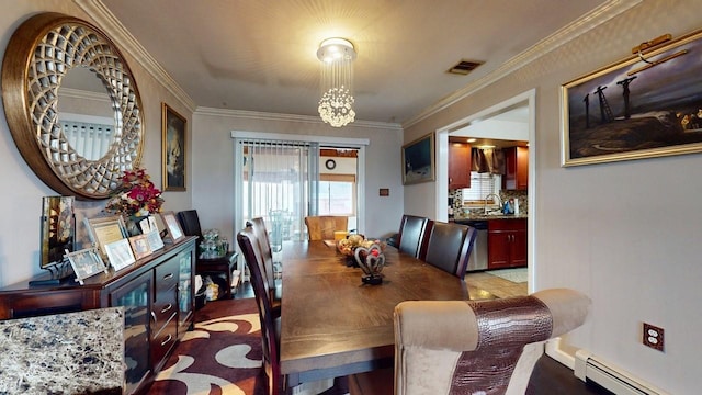 dining room featuring baseboard heating, visible vents, and ornamental molding