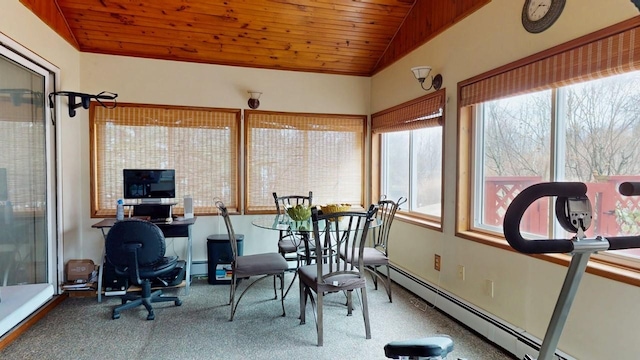 sunroom / solarium with wooden ceiling, a baseboard heating unit, and vaulted ceiling