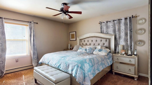 bedroom with a baseboard radiator, baseboards, and a ceiling fan