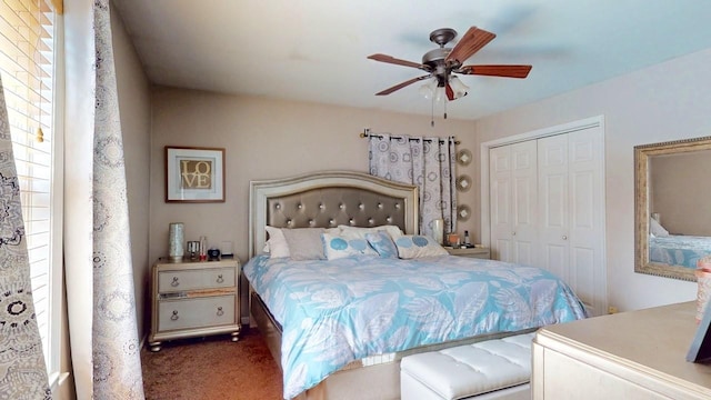 carpeted bedroom featuring a closet, multiple windows, and a ceiling fan